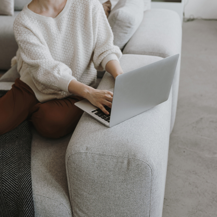 Woman on the Couch Using Laptop